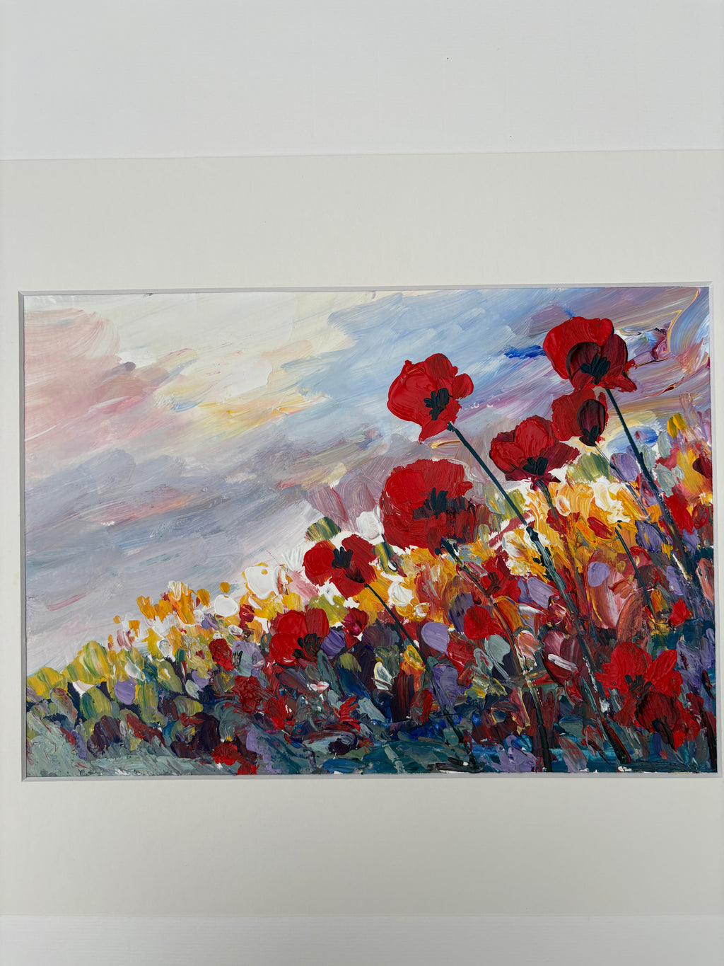 Coquelicots dans un champ fleuri